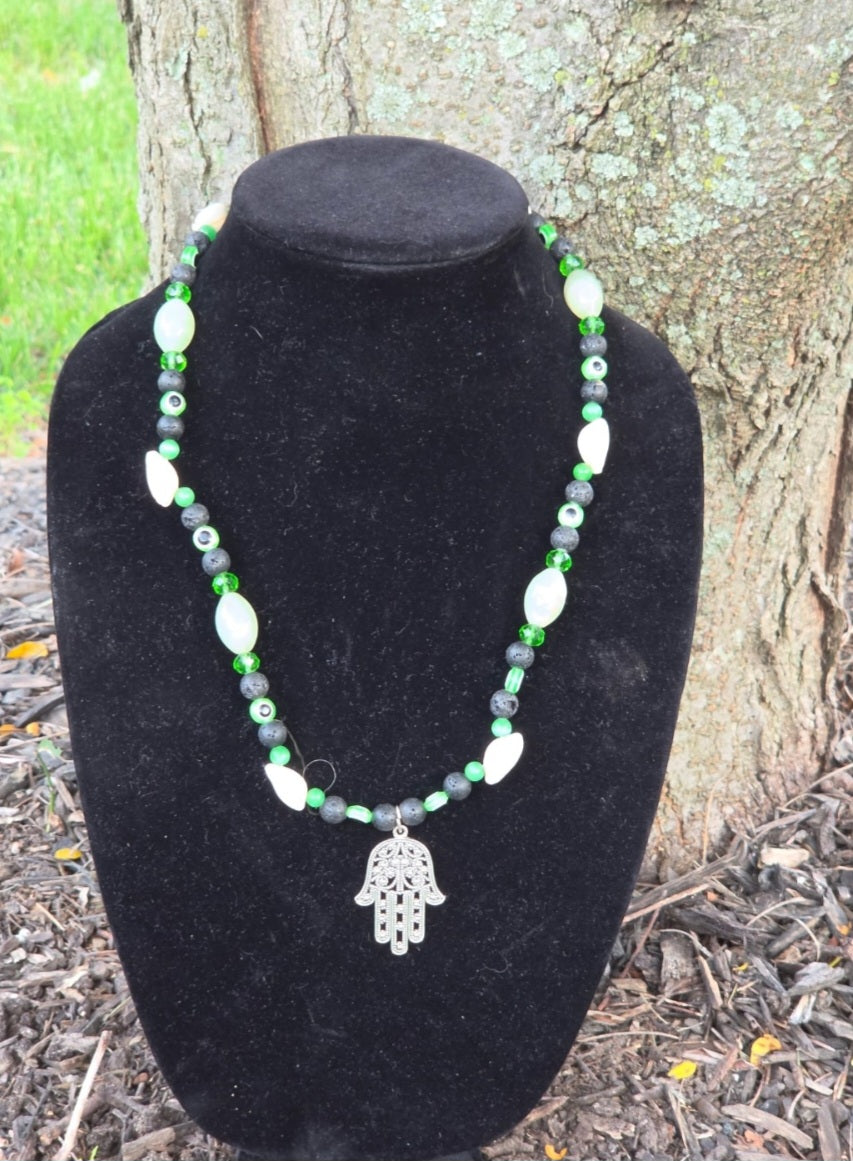 Necklace- Cowrie Shell Hamsa Hand (Lava Stone)